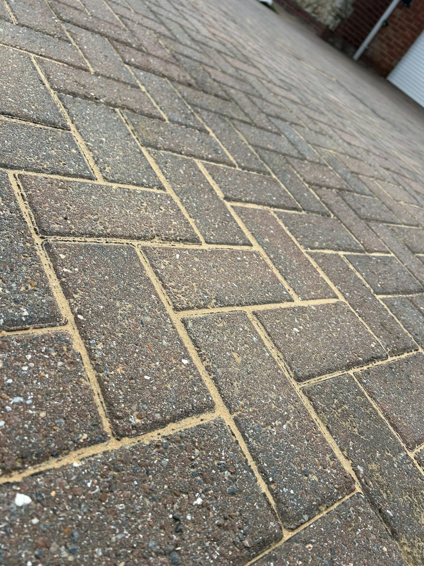Block paving jet washing showing cleaning patterns and professional maintenance work